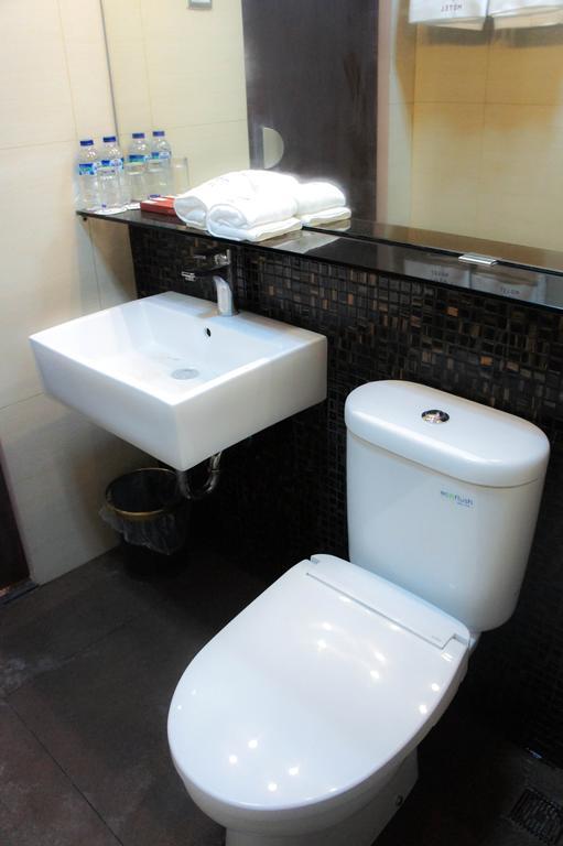 Favor Hotel Makassar Kamer foto